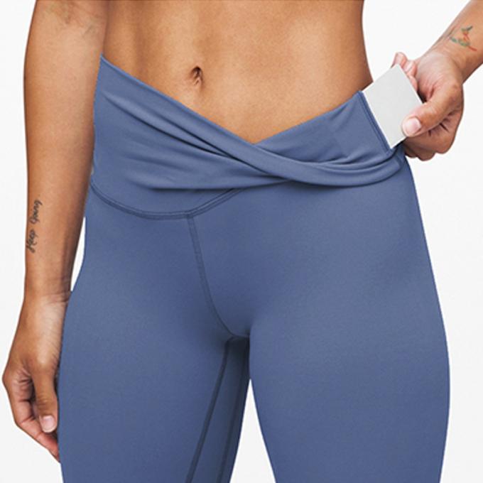 I pantaloni di yoga di forma fisica dell'elastam della mutanda di yoga del bootleg delle donne calde di Saling con vita di allenamento della tasca l'alta sgranocchiano le ghette di estremità