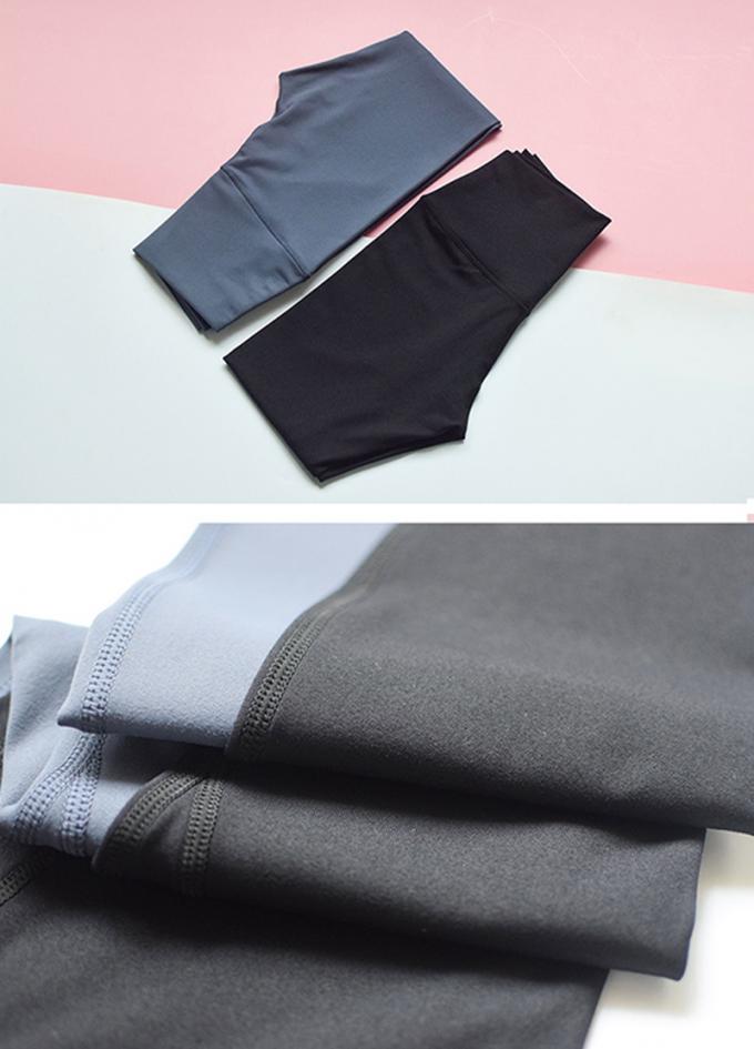 I pantaloni di yoga di forma fisica dell'elastam della mutanda di yoga del bootleg delle donne calde di Saling con vita di allenamento della tasca l'alta sgranocchiano le ghette di estremità