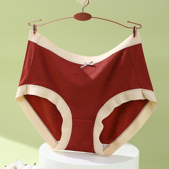 Il cotone medio di Traceless della vita della ragazza all'ingrosso respirabile più la biancheria intima di dimensione 3 strati cola le mutandine delle donne della prova